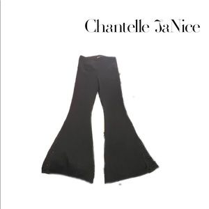 Boot leg flare pants. Black. Athena Marie. Size Medium. Lace slit.